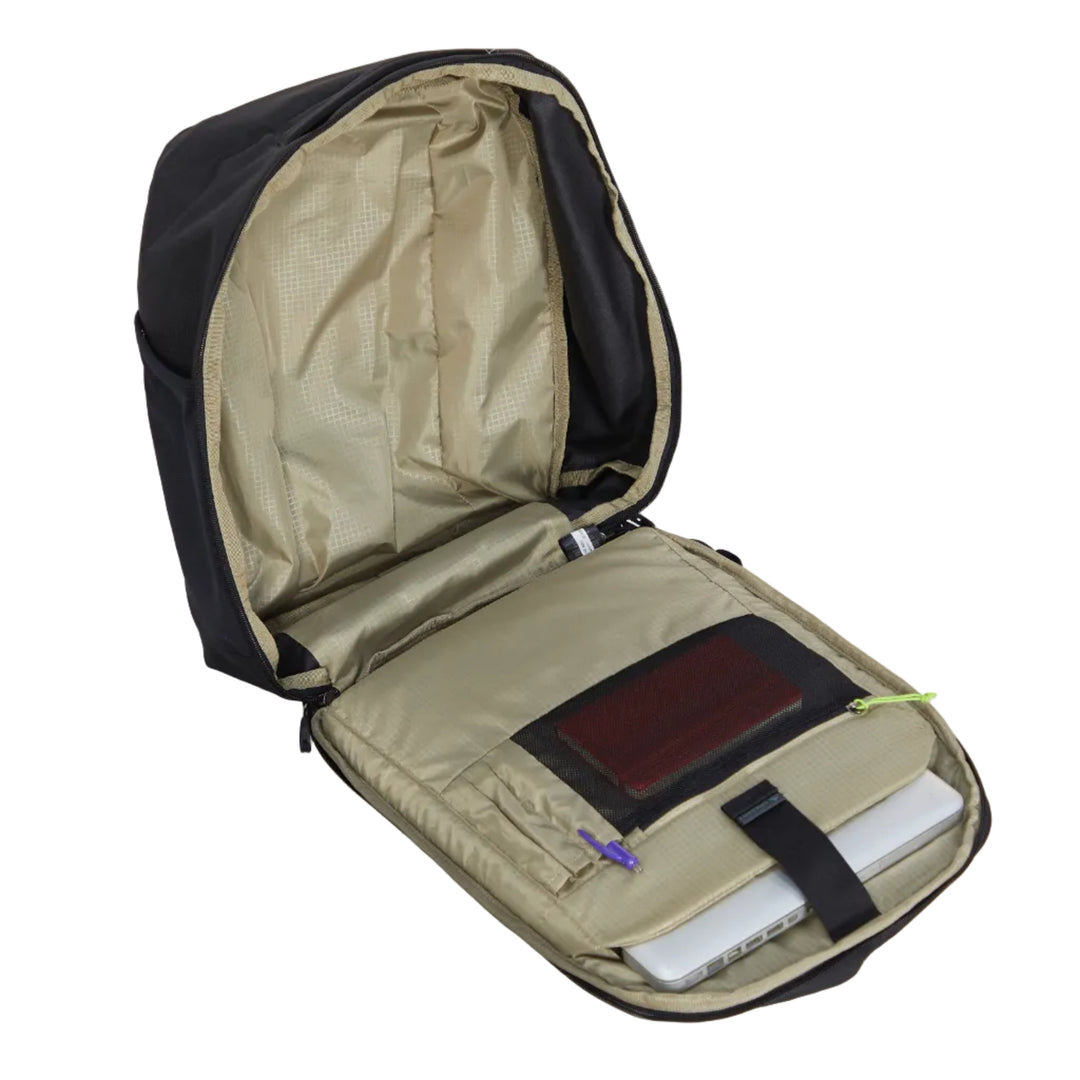 An open black backpack shown from above on a light gray background, revealing a beige interior with a laptop organizer pocket holding a silver laptop and accessories.