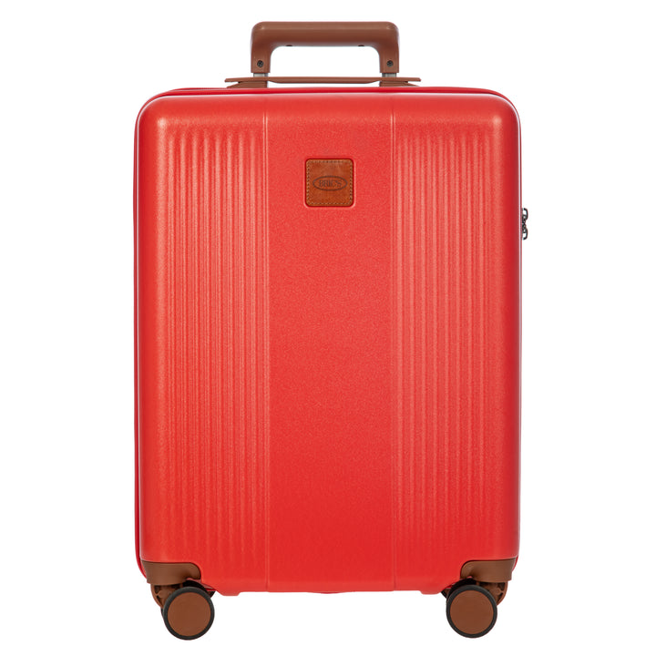 Red Bric's small cabin suitcase with brown handle and wheels on a white background