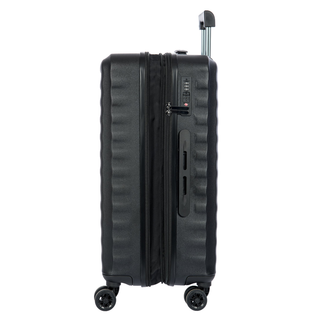 Side angle of a Black Bric's suitcase with a textured surface on a white background