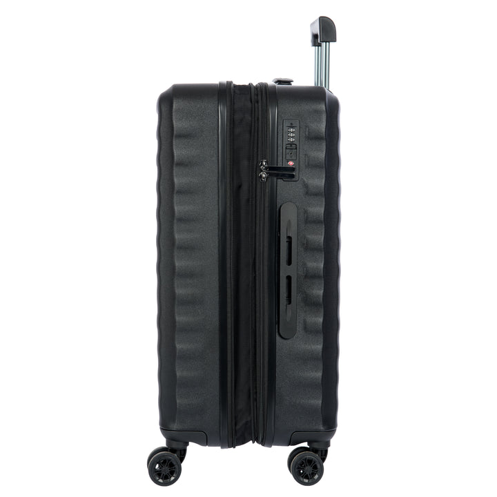 Side angle of a Black Bric's suitcase with a textured surface on a white background