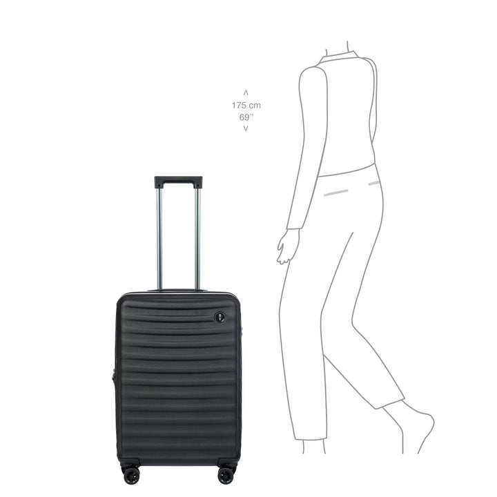 Black suitcase with dimensions shown relative to a person's height on a white background