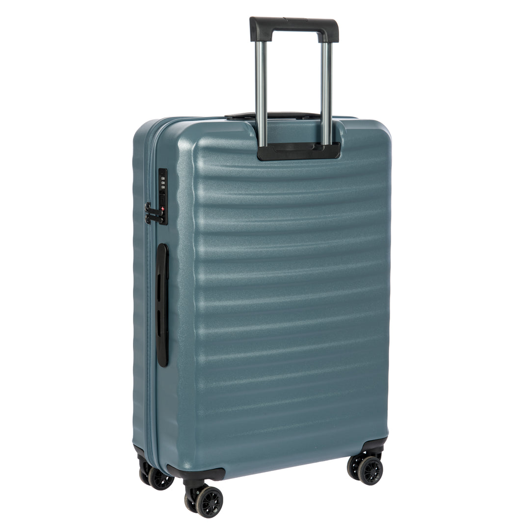 Back of a Blue Bric's suitcase with a ribbed texture on a white background