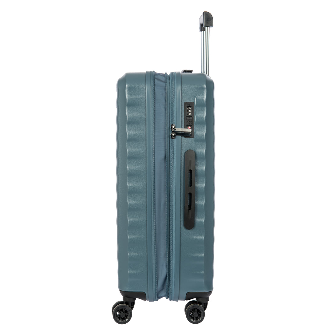 Side angle of a Blue Bric's suitcase with a ribbed texture on a white background