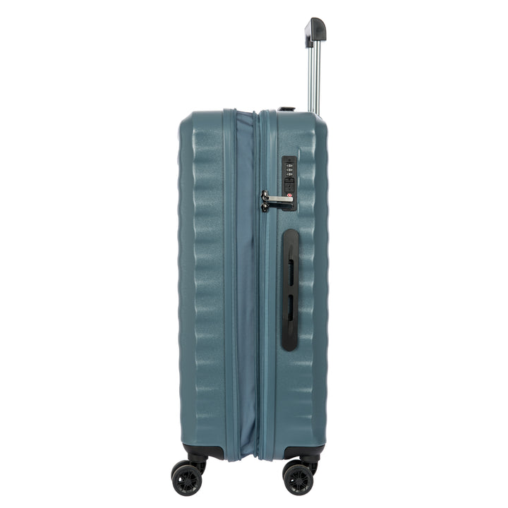 Side angle of a Blue Bric's suitcase with a ribbed texture on a white background