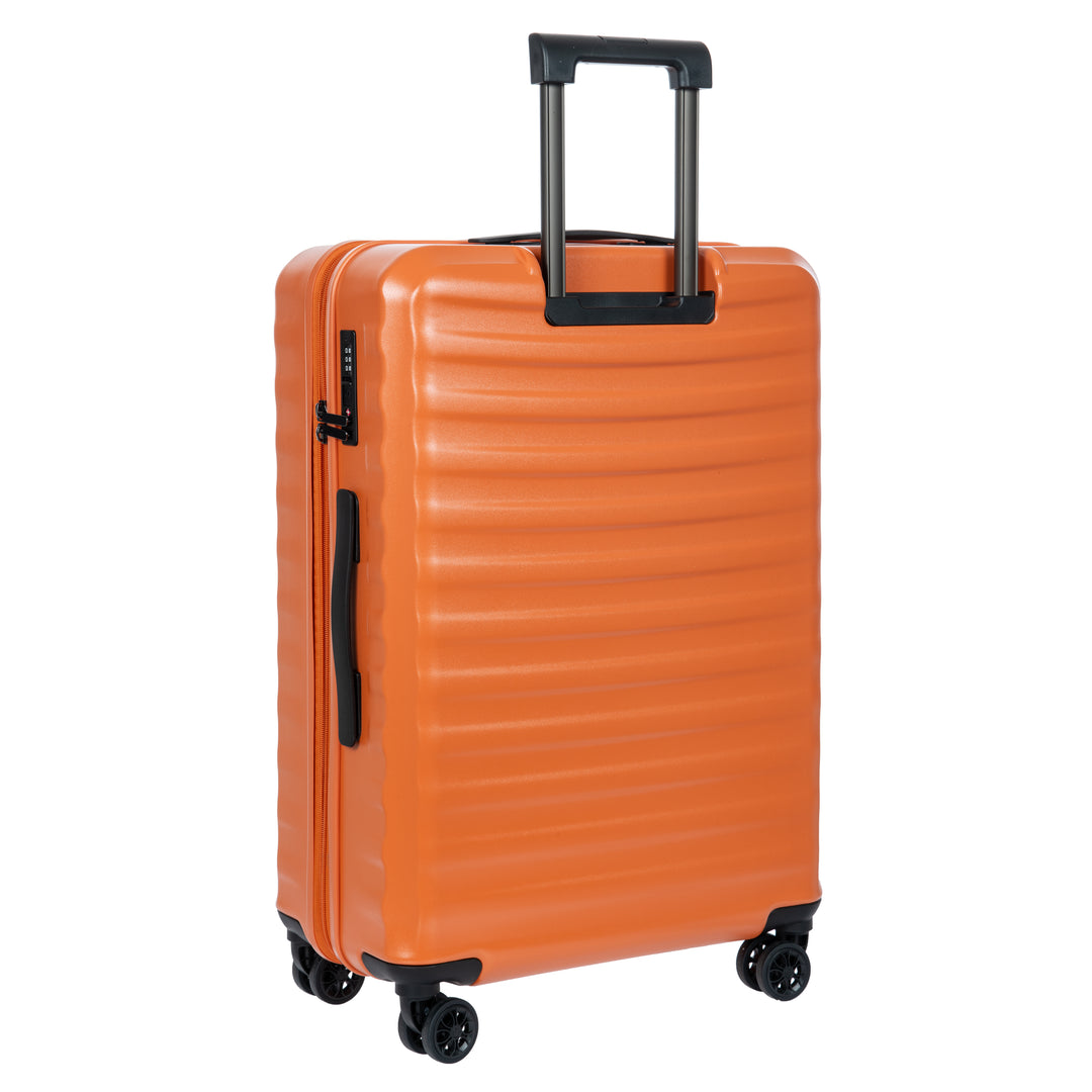 Back of an Orange Bric's suitcase with a textured surface on a white background