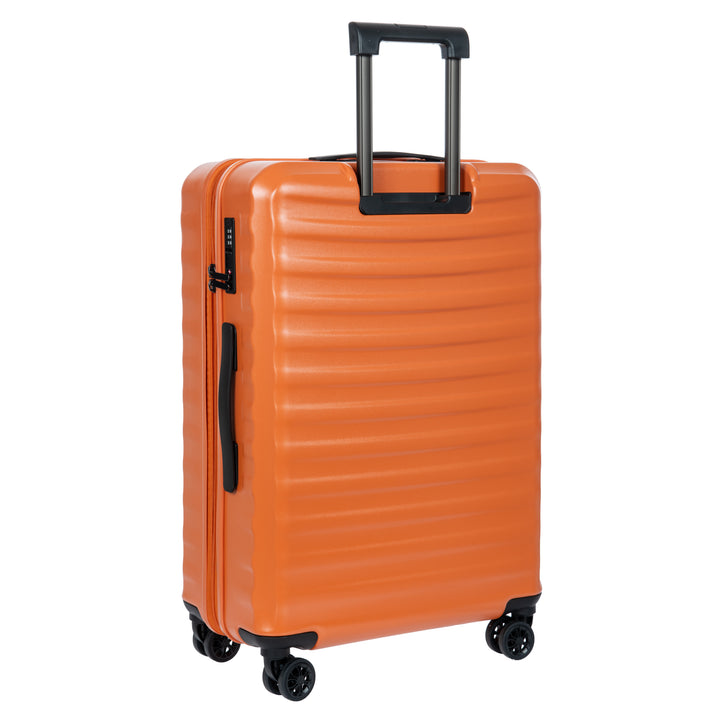 Back of an Orange Bric's suitcase with a textured surface on a white background