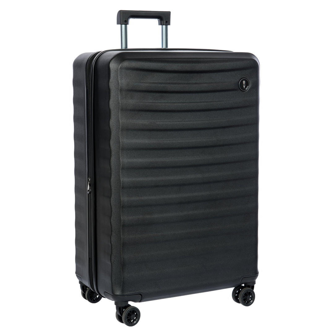 Black Bric's suitcase with a textured surface on a white background