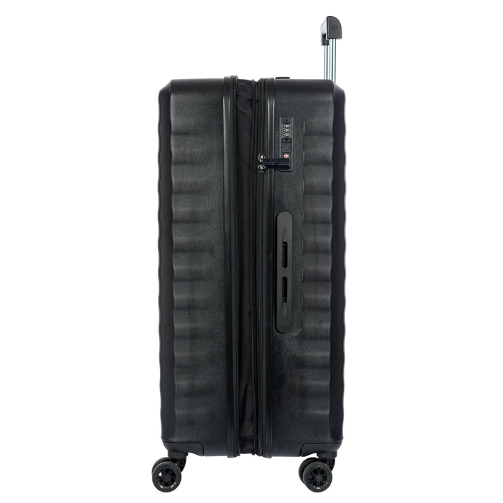 Side angle of a Black Bric's suitcase with a textured surface on a white background