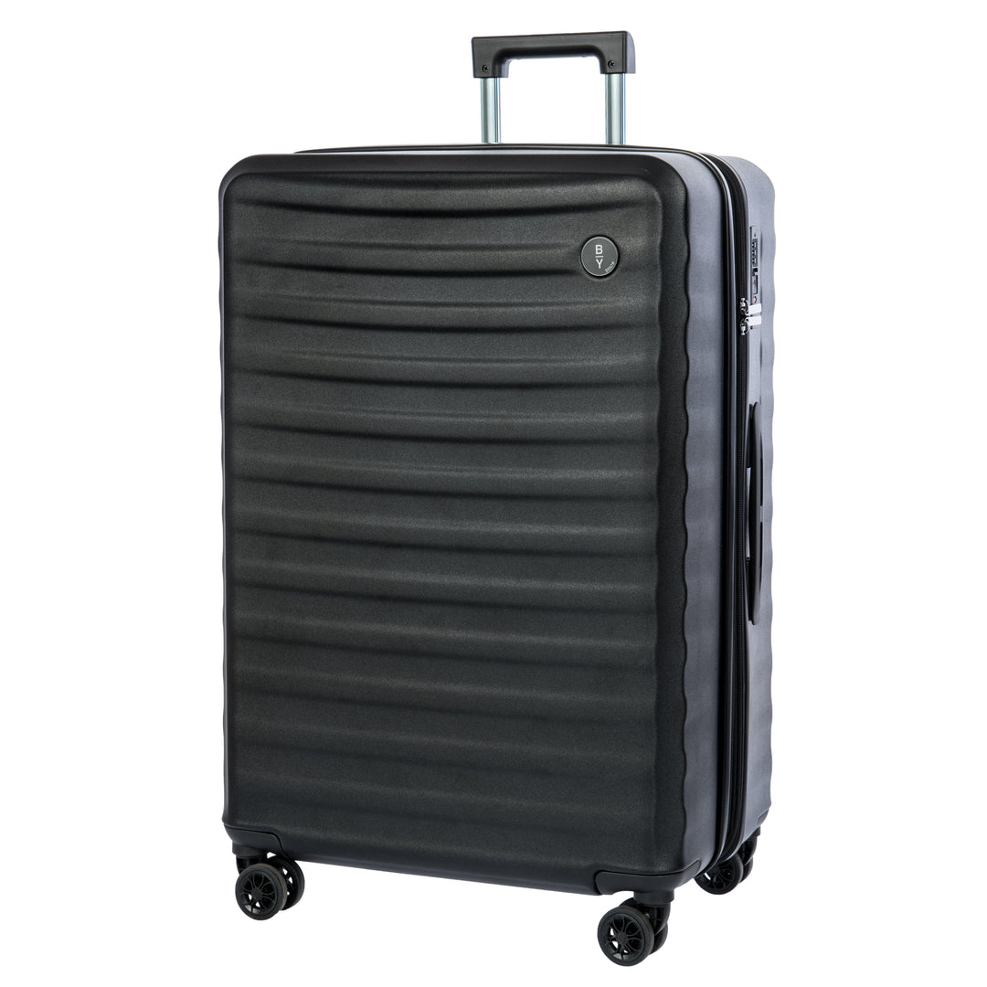 Black Bric's suitcase with a textured surface on a white background