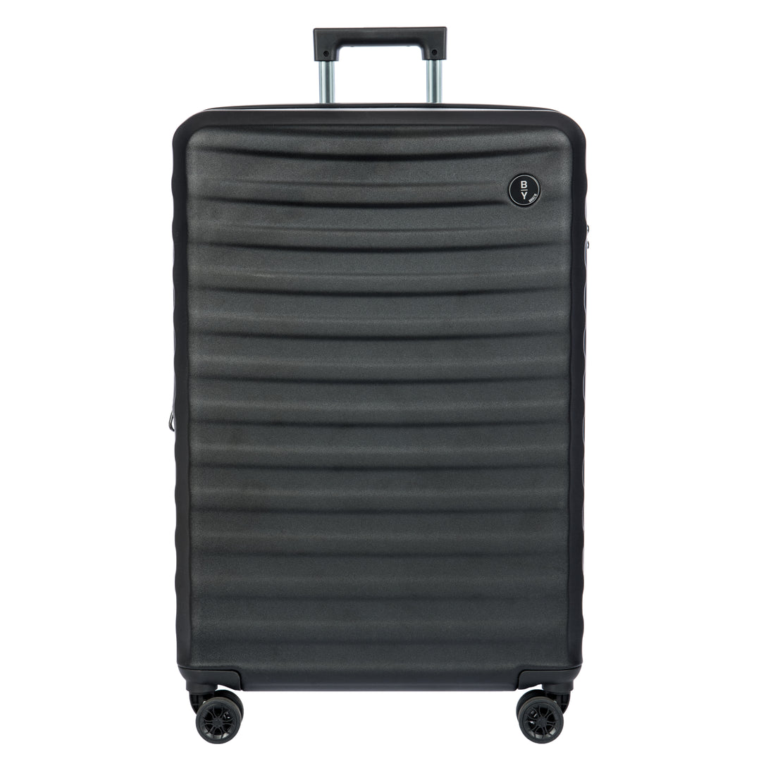 Black Bric's suitcase with a textured surface on a white background