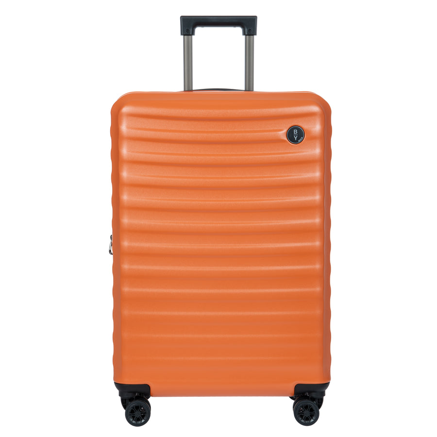 Orange Bric's suitcase with a textured surface on a white background