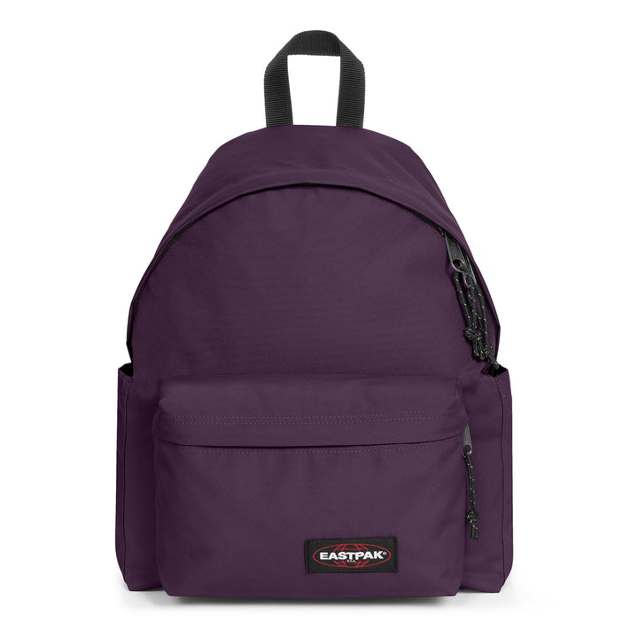 A dark purple Eastpak backpack with black accents, including a top handle, zipper pulls, and a black brand patch on the front pocket, shown against a plain white background.