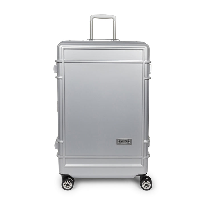 A silver aluminum look spinner suitcase with a telescoping handle extended and four wheels, shown against a plain white background.