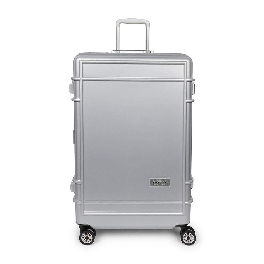 A silver aluminum look spinner suitcase with a telescoping handle extended and four wheels, shown against a plain white background.