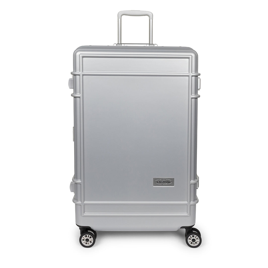 A silver hard-shell suitcase with a telescoping handle and four spinner wheels, shown from a front-facing angle on a white background.