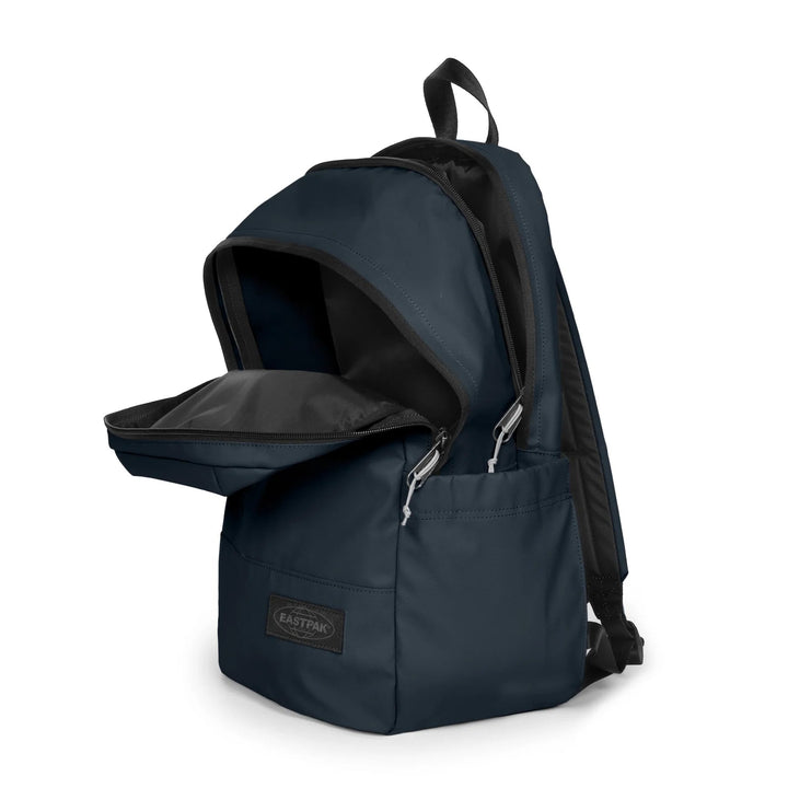 A navy blue Eastpak backpack with the front zippered pocket open, showing a black interior lining and silver zipper pulls, set against a plain white background.