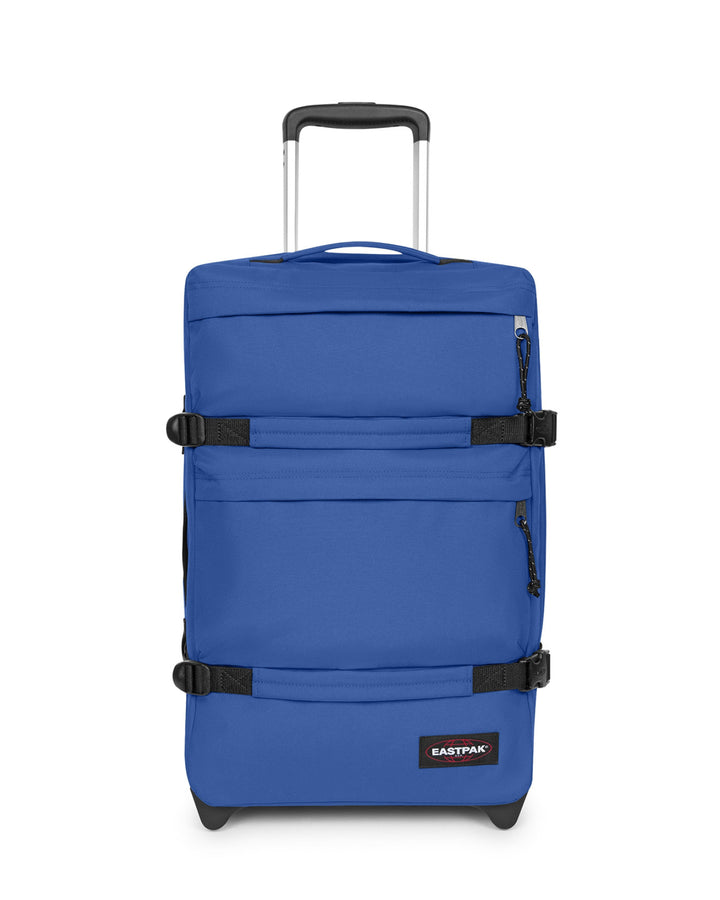 Blue suitcase with black straps on a white background