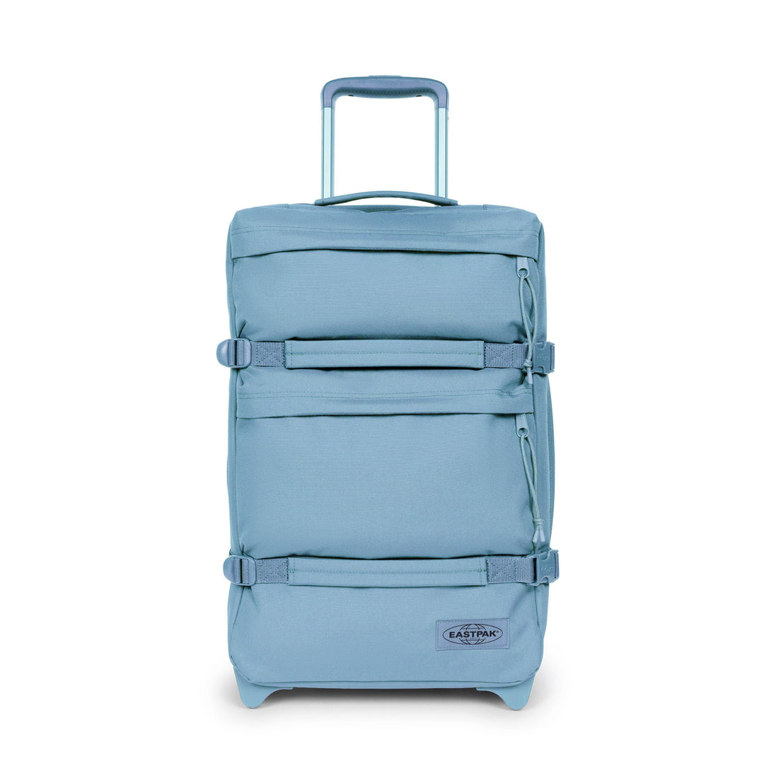Blue suitcase with a visible brand logo on a white background