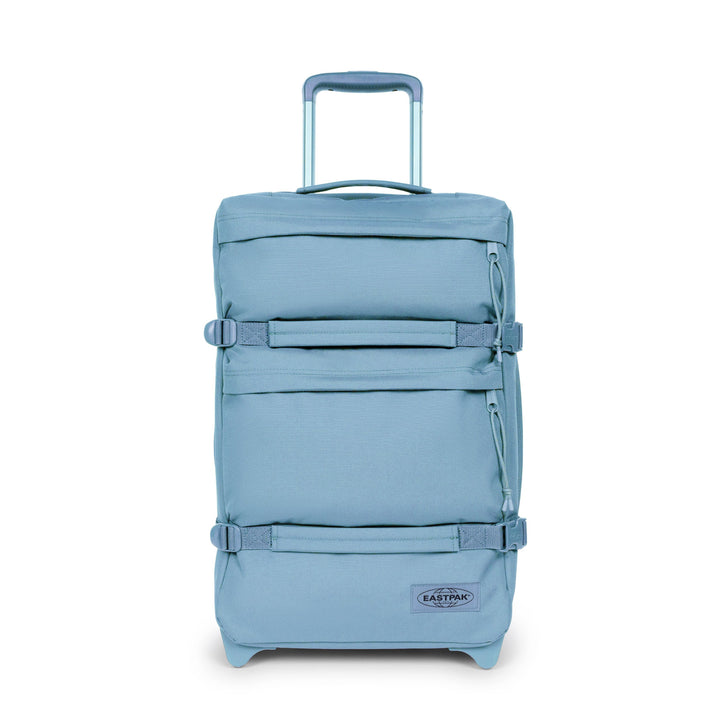 Blue suitcase with a visible brand logo on a white background