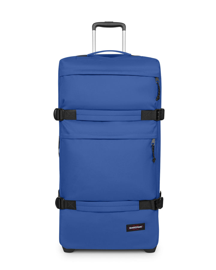Blue suitcase with black straps on a white background