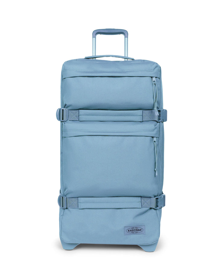Blue suitcase with a visible brand logo on a white background