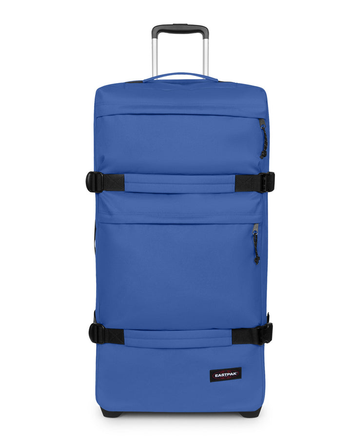 Blue suitcase with black straps on a white background