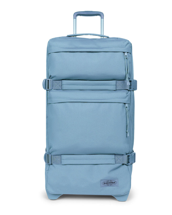 Blue suitcase with wheels on a white background