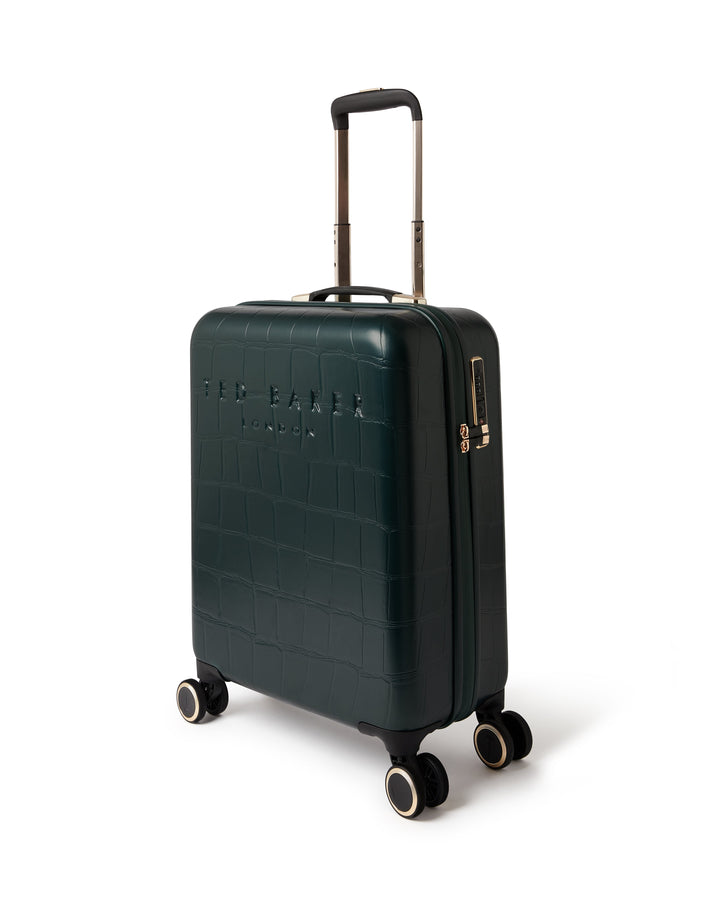 Green croc effect suitcase with gold zipper on a white background
