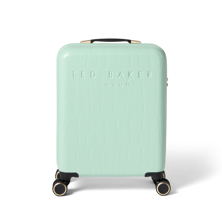 Mint green suitcase with 'Ted Baker' branding on a white background