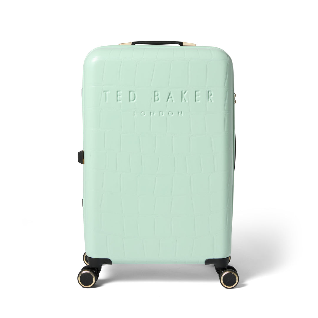 Mint green suitcase with Ted Baker branding on a white background