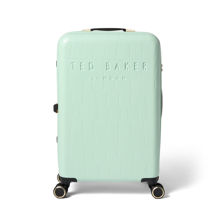 Mint green suitcase with Ted Baker branding on a white background