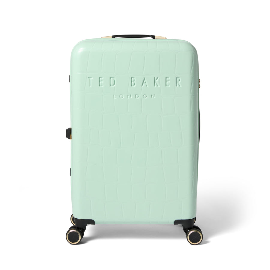 Mint green suitcase with Ted Baker branding on a white background