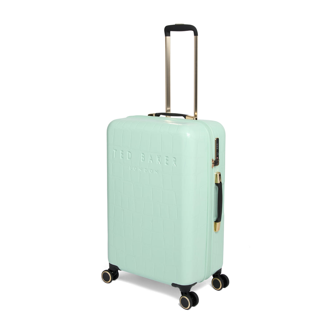 Mint green suitcase with gold handle and wheels on a white background
