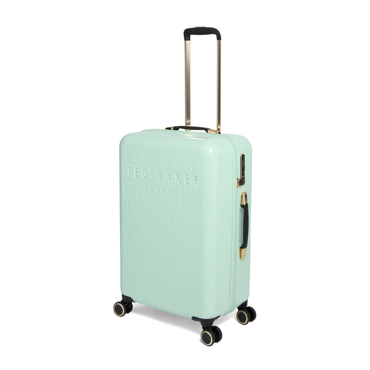 Mint green suitcase with gold handle and wheels on a white background