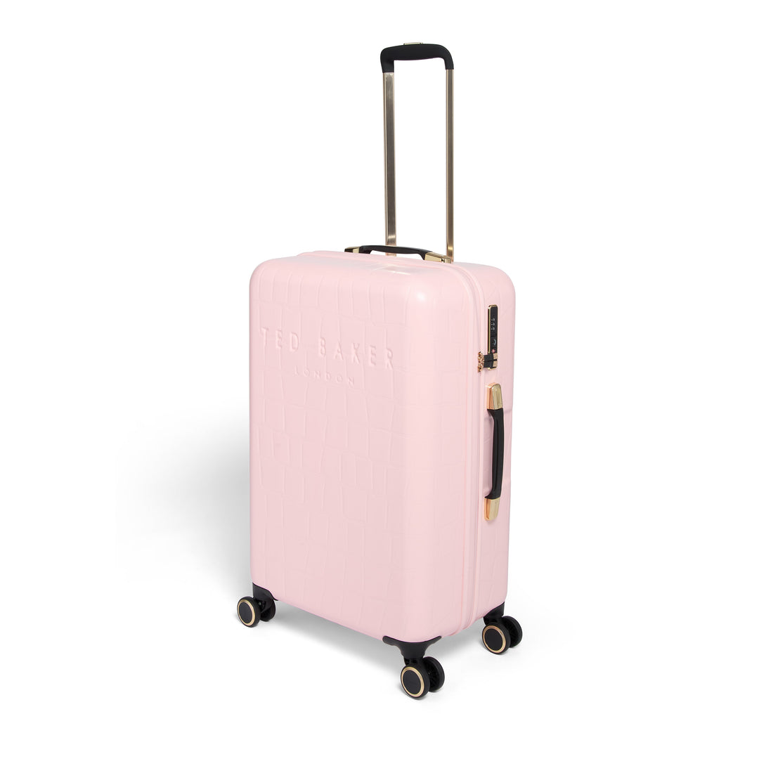Pink suitcase with gold handle and wheels on a white background