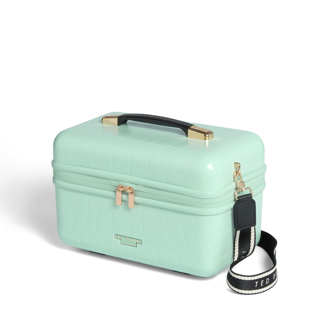 Mint green makeup case with black strap on a white background