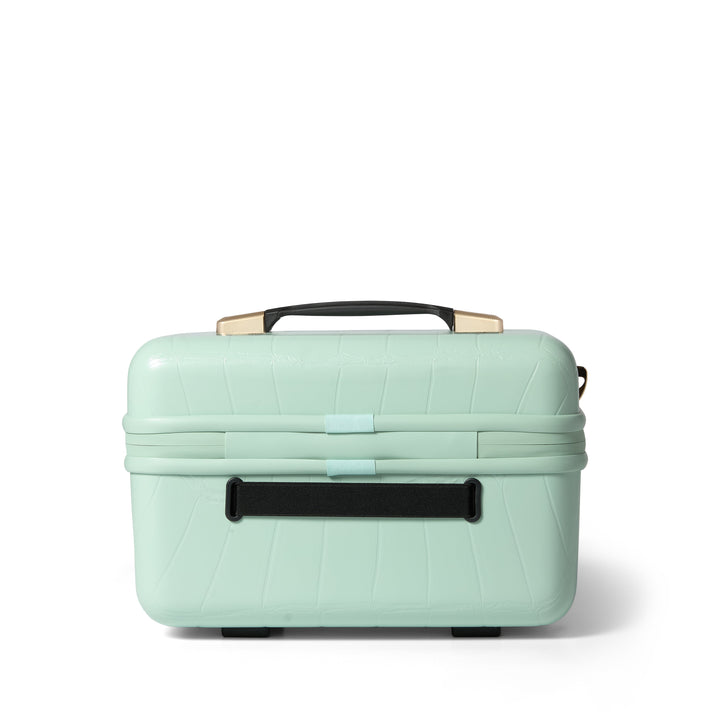 Mint green makeup vanity case with black handle on a white background