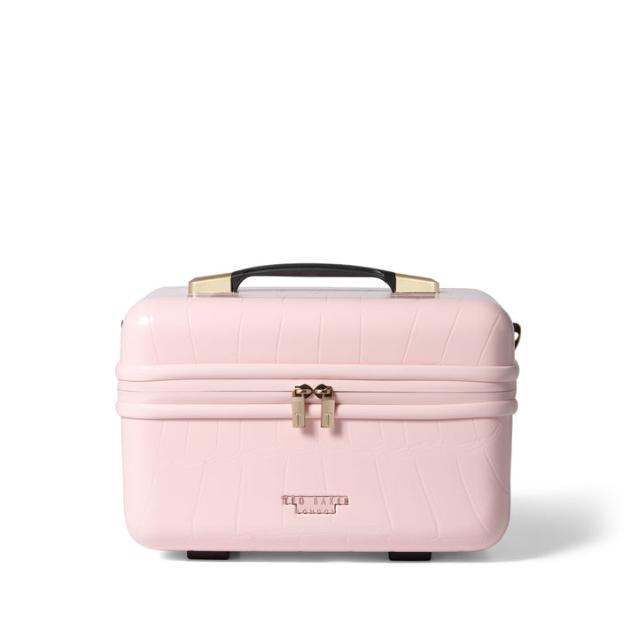 Pink makeup case with gold accents on a white background