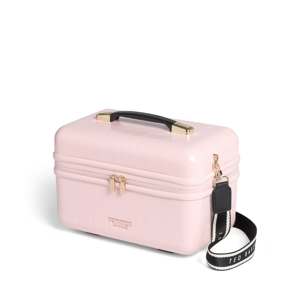 Pink makeup case with a strap on a white background