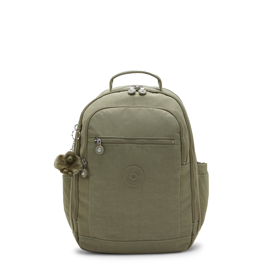 Green Kipling backpack with a decorative monkey charm on a white background