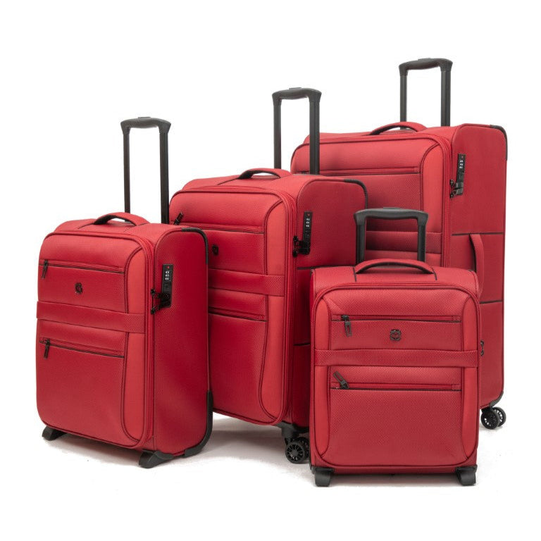 Set of red suitcases of different sizes on a white background