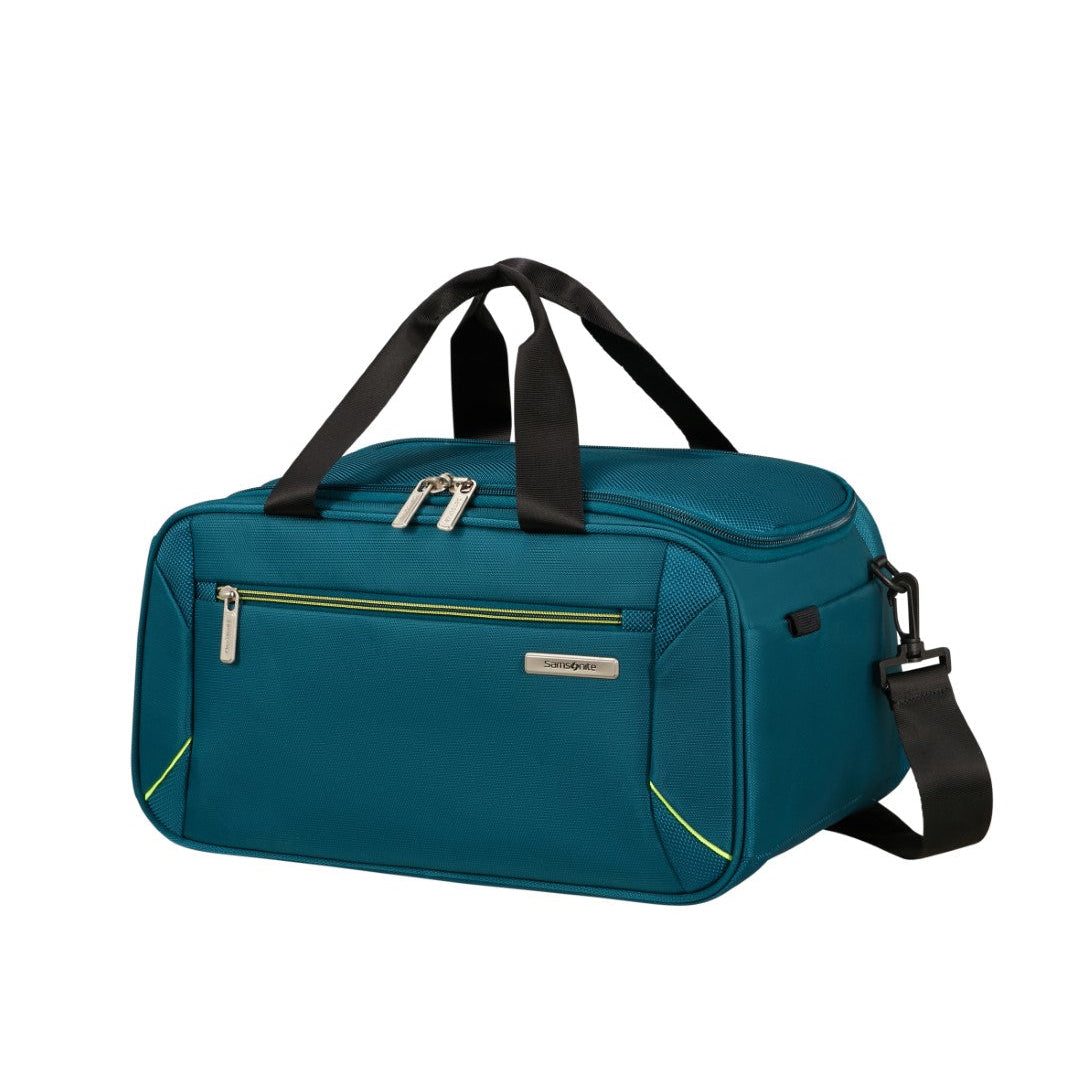 Teal duffel bag with black straps on a white background