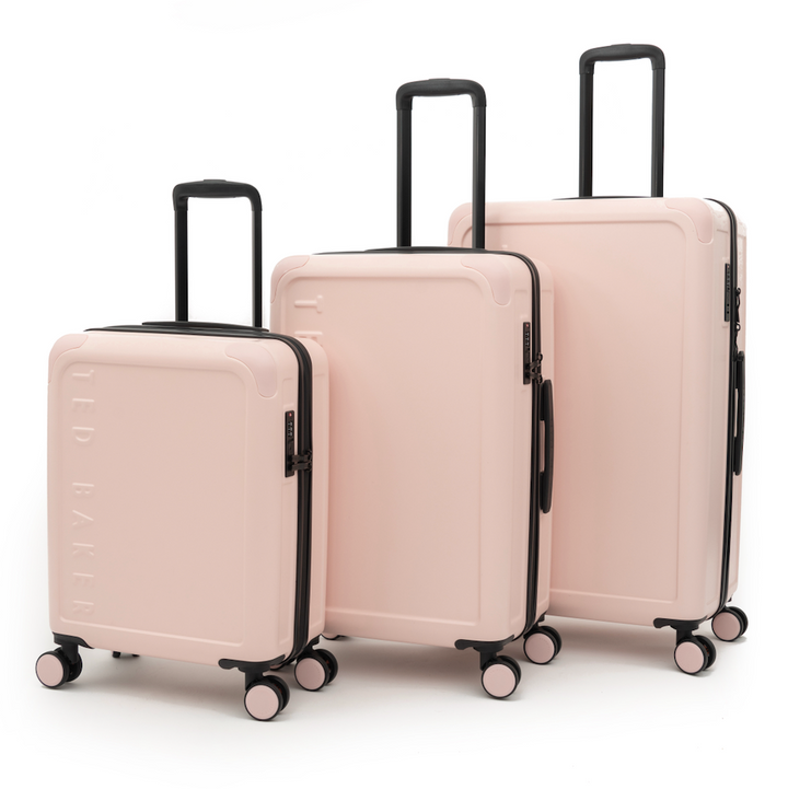 Set of three pink suitcases with black handles and wheels on a white background