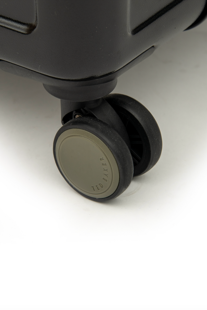 Close-up of a suitcase wheel on a white background