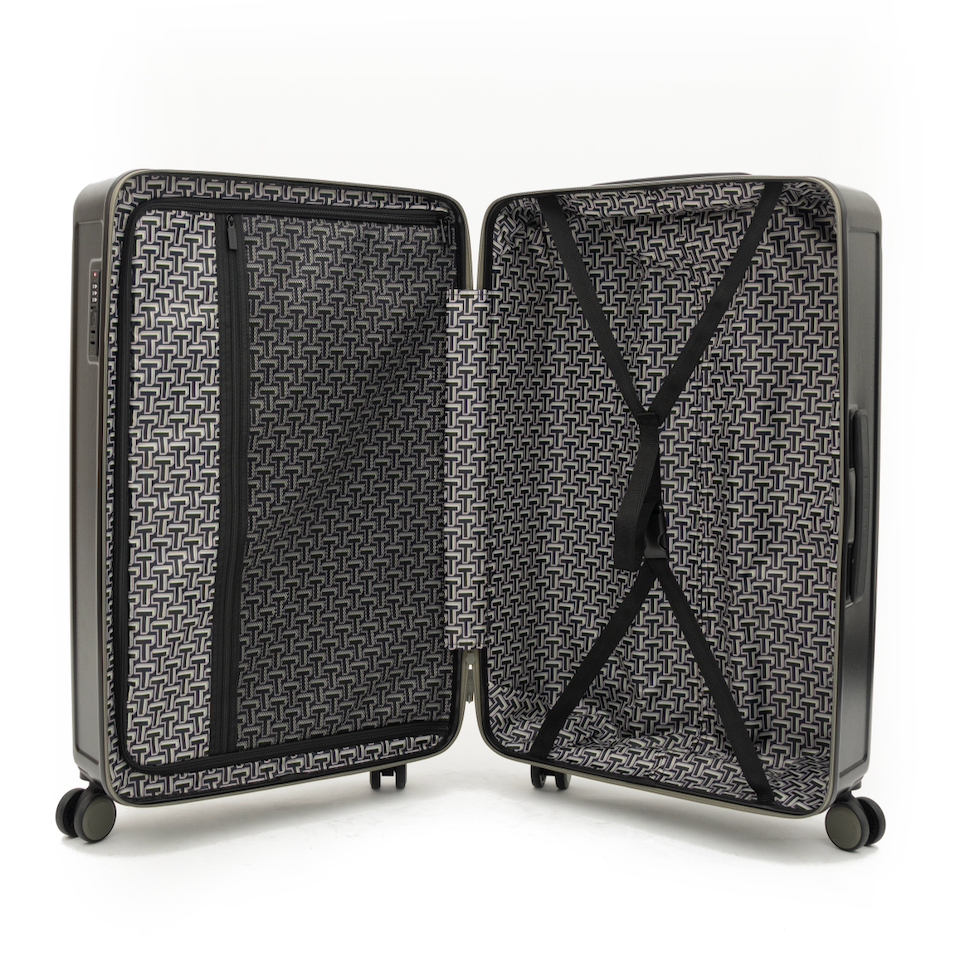 Open black suitcase with geometric pattern on a white background