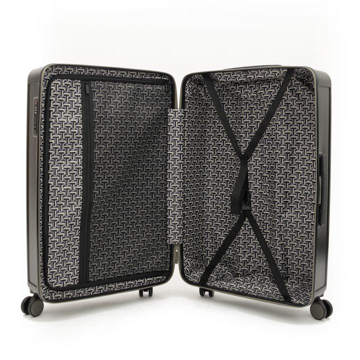 Open black suitcase with geometric pattern on a white background