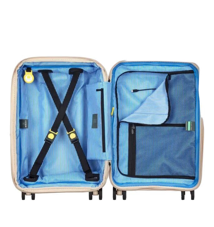 Open Delsey Paris suitcase with blue interior and black straps on a white background