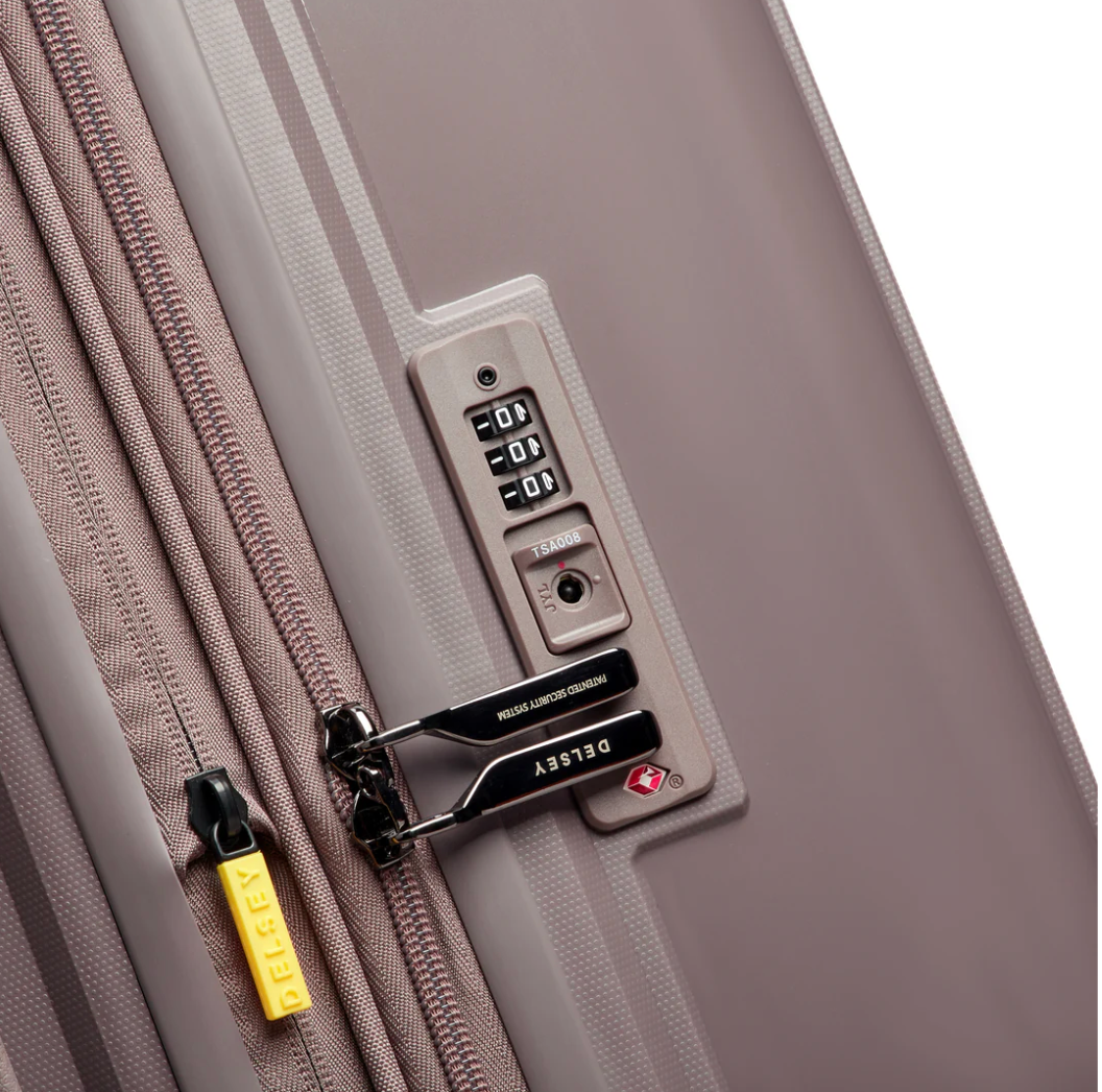 Close-up of a brown suitcase with a TSA combination lock and brand logo.