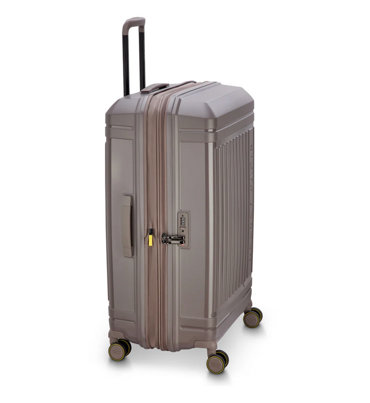 Brown Delsey Paris suitcase at a side angle with 4 wheels on a white background