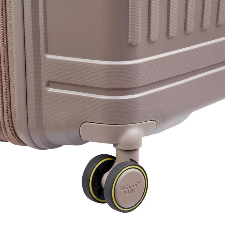 Close-up of a brown Delsey Paris suitcase wheel with a brand logo on a white background